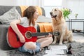 Girl teenager practicing guitar playing