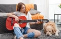 Girl teenager practicing guitar playing