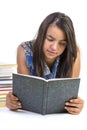 Girl teenager reading book over white background