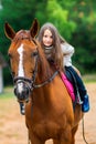 Girl walks with her beloved horse Royalty Free Stock Photo