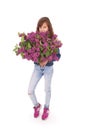 Girl teenager standing with lilac in hands Royalty Free Stock Photo