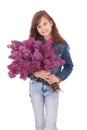 Girl teenager standing with lilac in hands Royalty Free Stock Photo