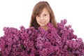 Girl teenager standing with lilac in hands Royalty Free Stock Photo