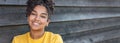 Girl teenager teen female young African American woman outside smiling panorama Royalty Free Stock Photo