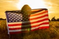 Girl Teenager Wrapped in USA Flag in Field at Sunset Royalty Free Stock Photo