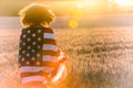 Girl Teenager Wrapped in USA Flag in Field at Sunset Royalty Free Stock Photo