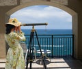 Girl with Telescope under Arch Royalty Free Stock Photo