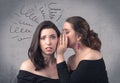 Girl telling secret things to her girlfriend Royalty Free Stock Photo