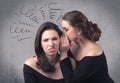 Girl telling secret things to her girlfriend Royalty Free Stock Photo