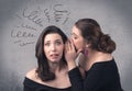 Girl telling secret things to her girlfriend Royalty Free Stock Photo