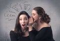 Girl telling secret things to her girlfriend Royalty Free Stock Photo