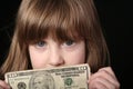 Girl with ten dollar bill Royalty Free Stock Photo