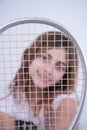 Girl with tennis racket in your face Royalty Free Stock Photo