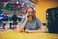 Girl texting on the smart phone in a restaurant terrace with an unfocused background Royalty Free Stock Photo