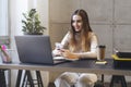 Female texting on smartphone. Manager having break at office, playing mobile games. Young woman commenting in social network app,