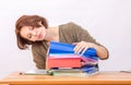 Girl thoughtfully office employee goes through a stack of folders