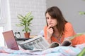 Girl thoughtfully reads with job offers announcements