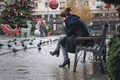 Girl thoughtfully sitting on the bench.