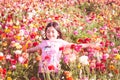 Girl throwing flower petals Royalty Free Stock Photo