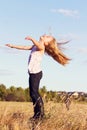 Girl throwing head back in wind