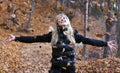 Girl throwing leaves in air