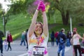 Girl throwing pink powder at Color Run Bucharest Royalty Free Stock Photo