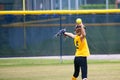 Girl Throwing a Softball