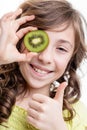 Girl thumb up for kiwi green vitamins