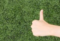 Girl Thumbs on background lawn Royalty Free Stock Photo