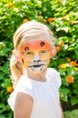 Girl with tiger face painting Royalty Free Stock Photo