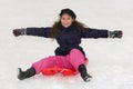 Girl with toboggan in the snow