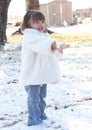 Girl Toddler Throwing Snow