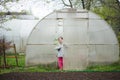 Girl with tomato seedling in her hands Royalty Free Stock Photo