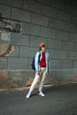 Girl tomboy photo in full growth. Street fashion