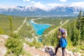 Staycation hike on top of mountain overlooking local town of Canmore and Kananaskis