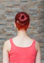 Girl with topknot and hidden undercut