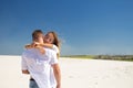 The girl touches a beloved man touchingly while the wind waves her blond hair