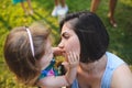 Girl Touching Mother`s Face