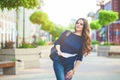 Girl tourist with map in hand on a city street Tourists concept. Exploring the city. Royalty Free Stock Photo