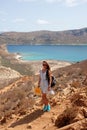 The girl tourist snapped photos atop the craggy cliffs