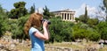 Girl tourist takes photo of Athens, Greece, Europe Royalty Free Stock Photo