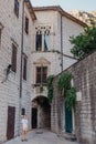 Girl Tourist Walking Through Ancient Narrow Street On A Beautiful Summer Day In MEDITERRANEAN MEDIEVAL CITY, OLD TOWN Royalty Free Stock Photo