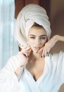 Girl with towel on head relaxing, after spa or shower. Royalty Free Stock Photo