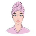 Girl with a towel on her head and a cosmetic mask on her face after a shower or bath Royalty Free Stock Photo