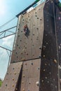 The girl on the tower of climbers conquers the peaks in an extreme park