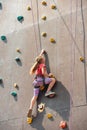 The girl on the tower of climbers conquers the peaks in an extreme park