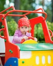 Girl in toy car Royalty Free Stock Photo