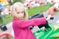 Girl in toy car Royalty Free Stock Photo