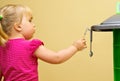 Girl and toy kitchen Royalty Free Stock Photo