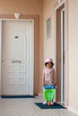 Girl and toy wheelbarrow